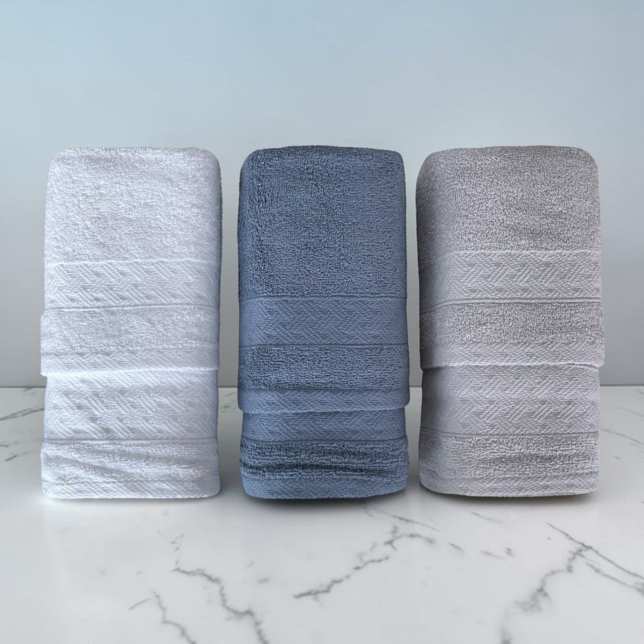 Asciugamani viso e ospite Rebecca Home Treccia piegati nei colori bianco, indigo e grigio