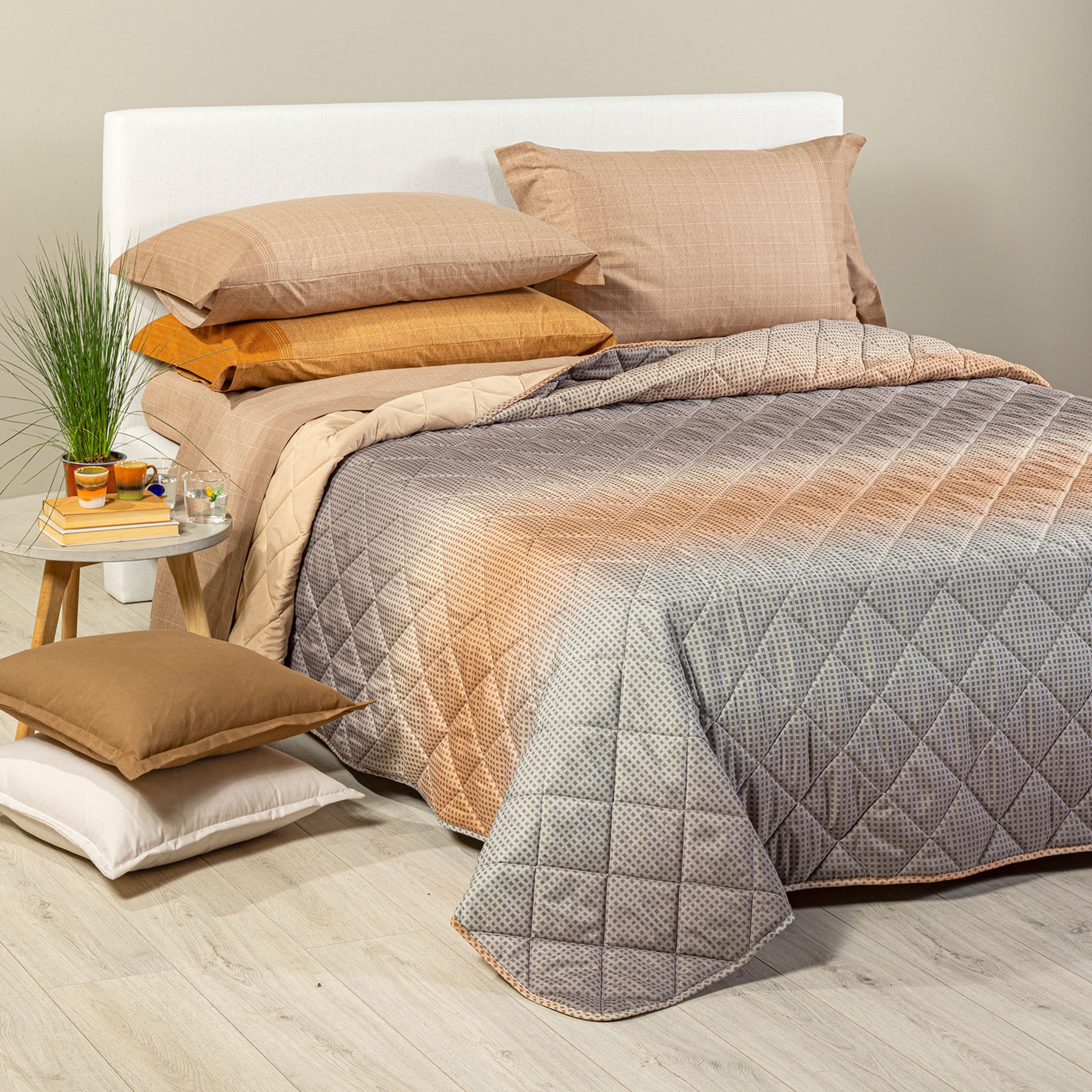 Copriletto Caleffi Larry gold con design sfumato e trapuntatura geometrica a rombi