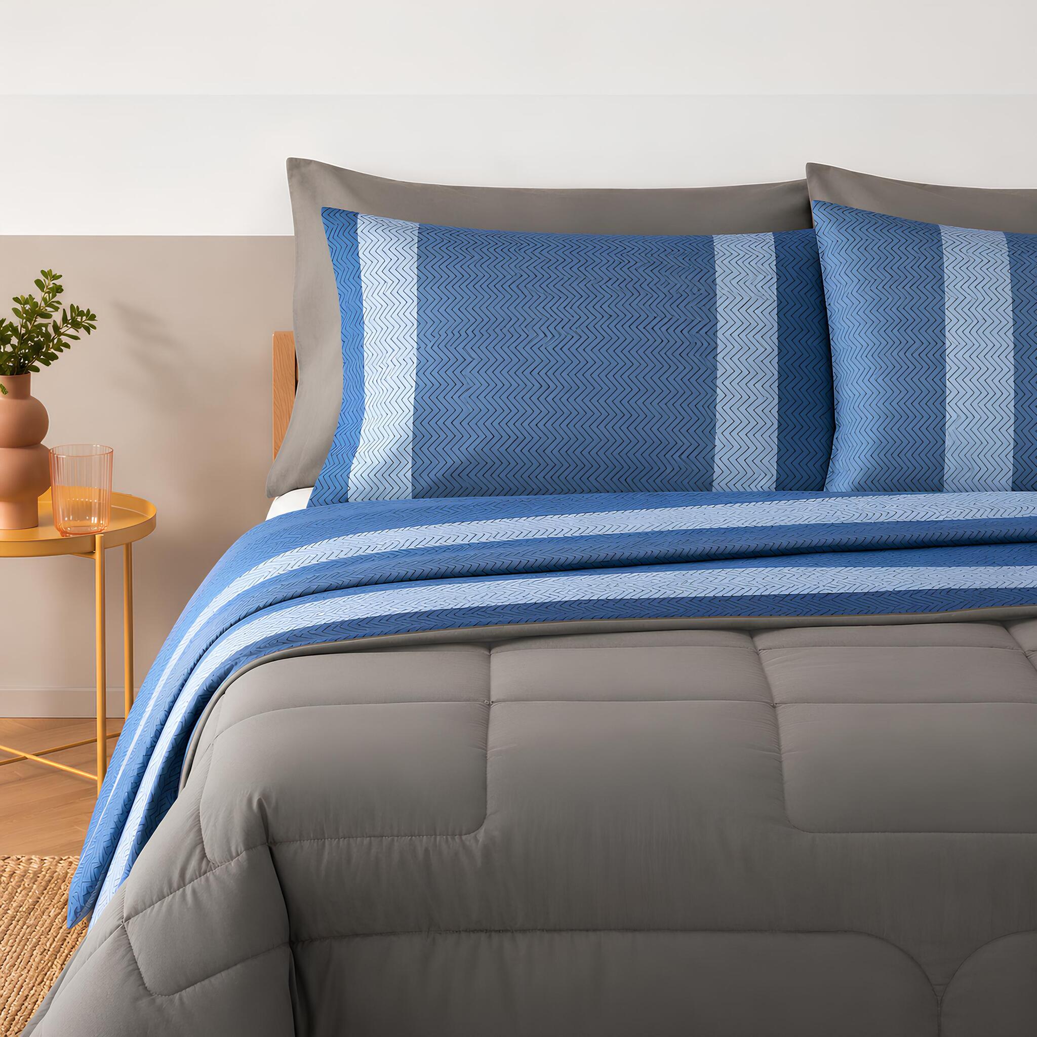 Completo lenzuola matrimoniale Bassetti Nostalgia blu in 100% cotone con design geometrico a righe