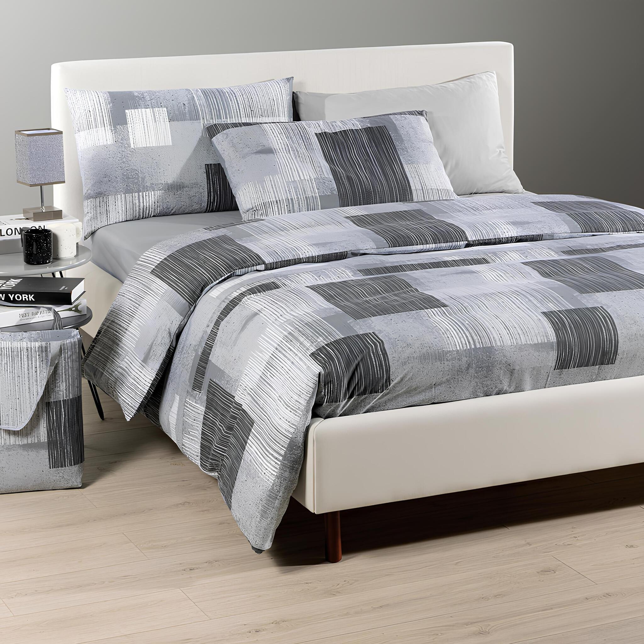 Completo copripiumino Caleffi Lisbona antracite ambientato in una camera da letto moderna