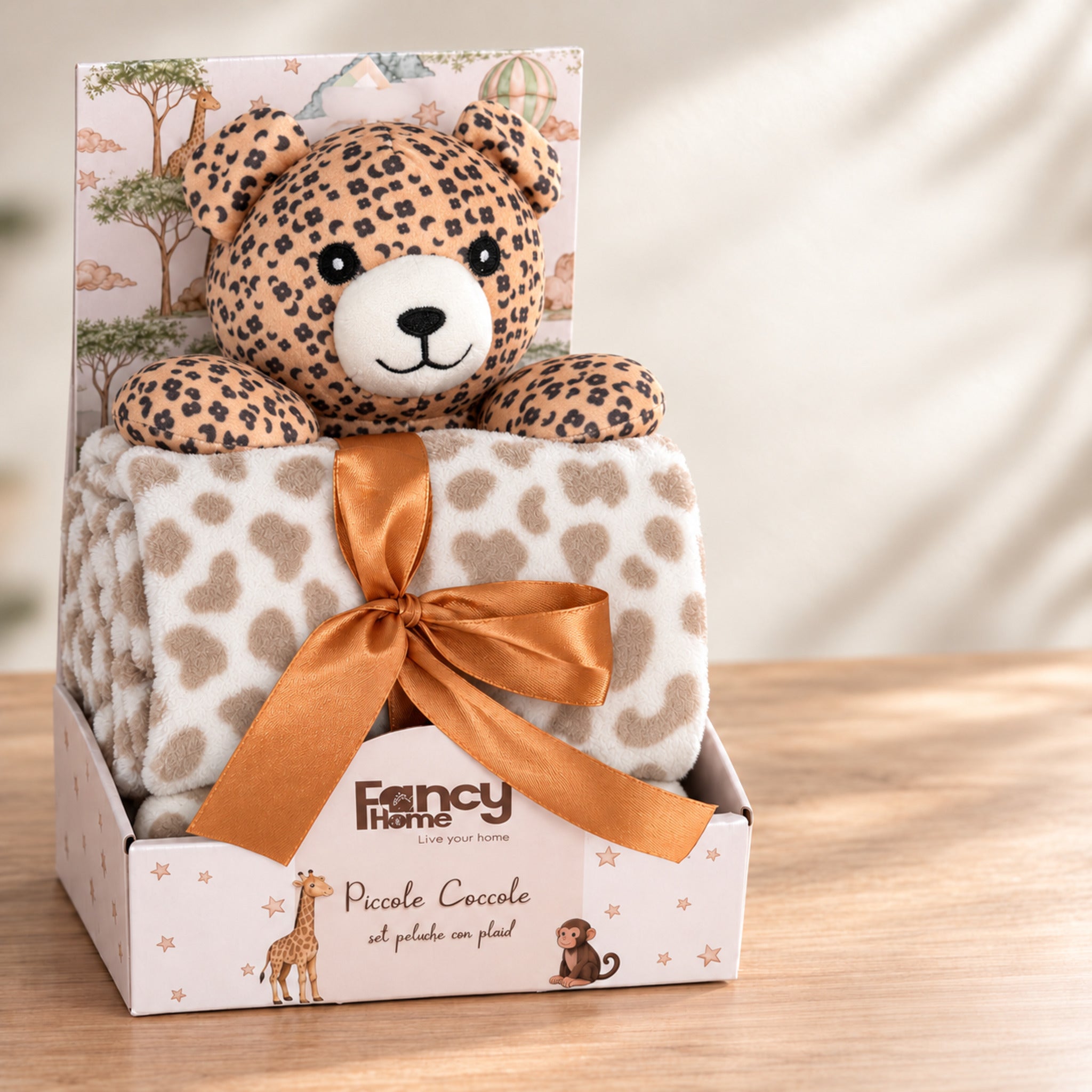 Set Fancy Home Piccole Coccole con peluche leopardo copertina avorio maculata, in confezione regalo con fiocco arancione.