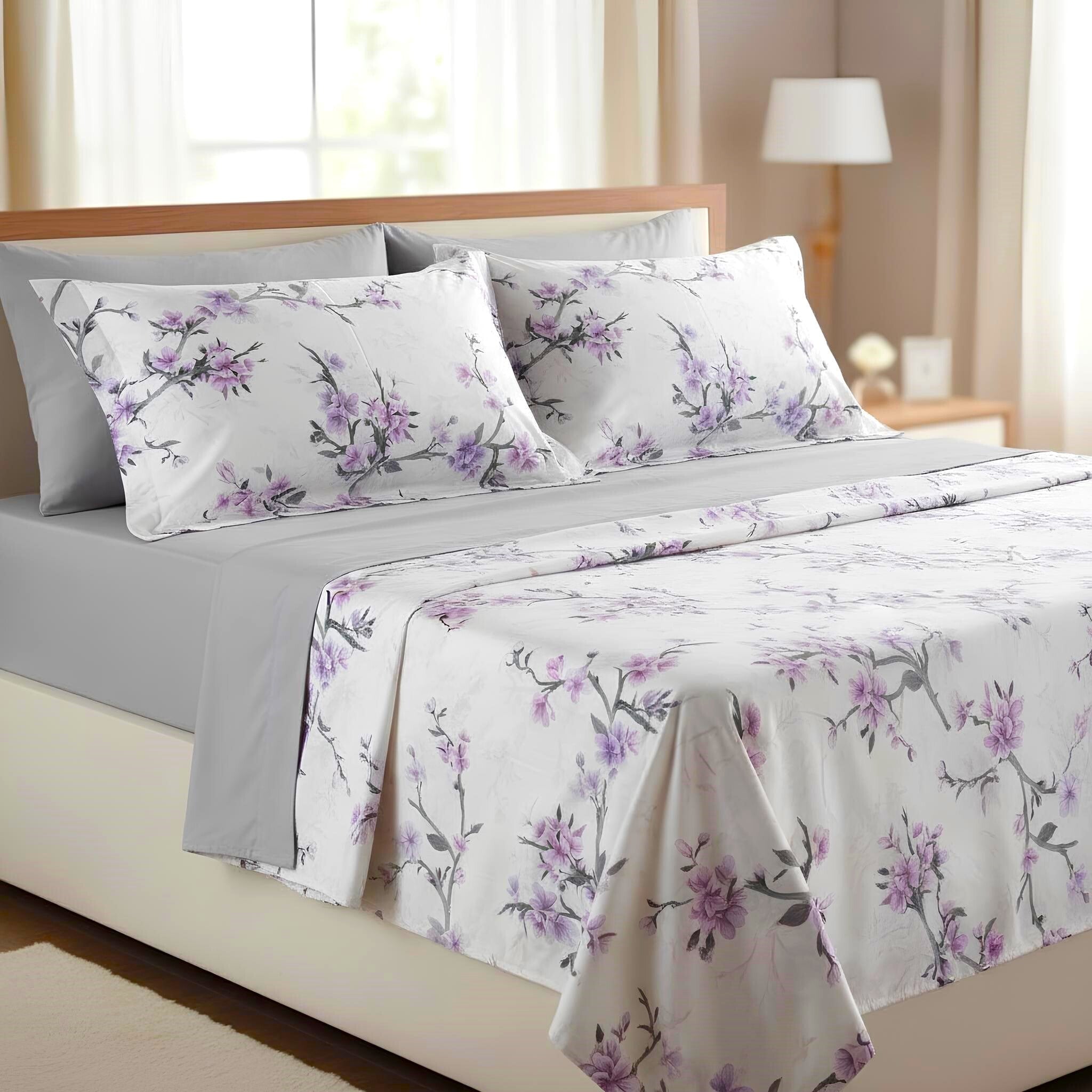 Completo lenzuola matrimoniale Mirabello Blossom Peach lilla su letto elegante