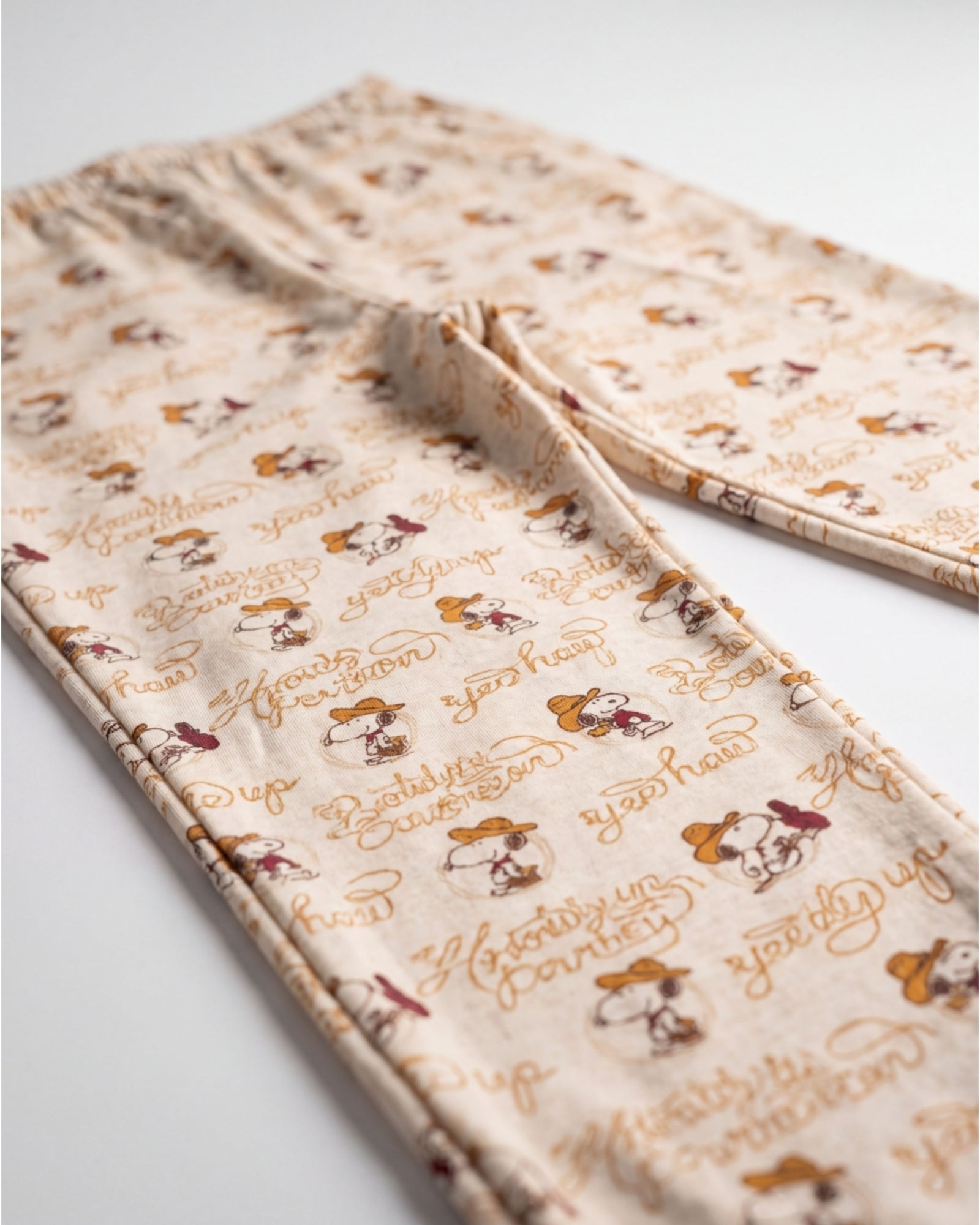 Pantalone beige del pigiama bambina Peanuts con stampa Snoopy Art. 64460