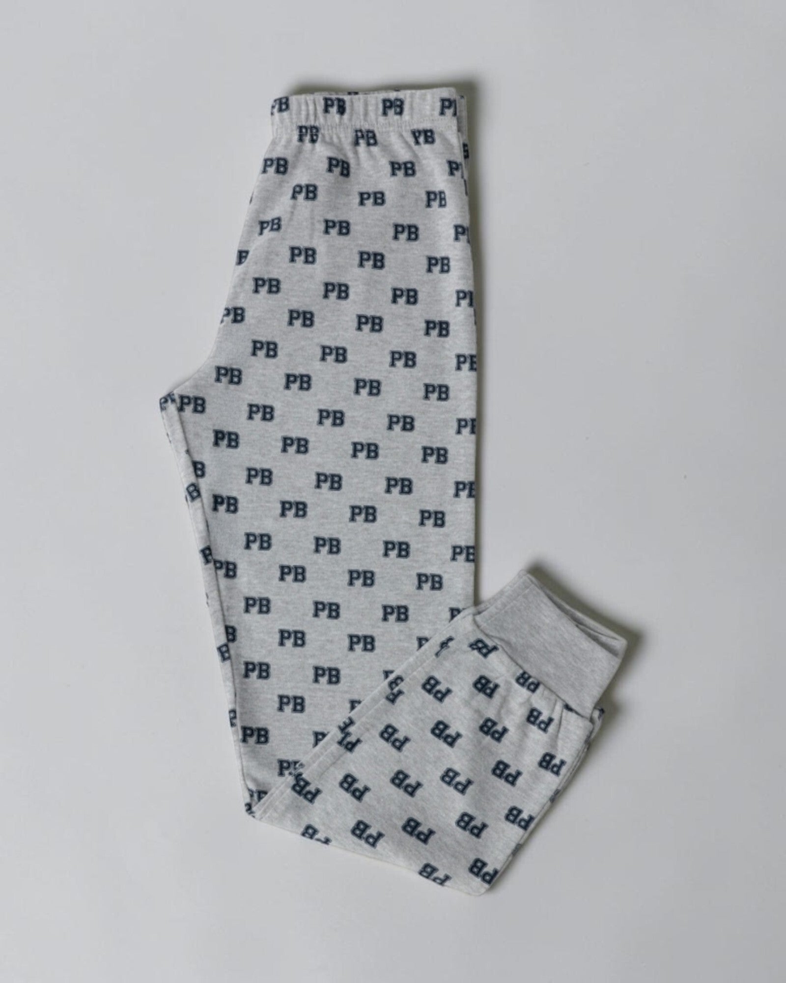 Pantaloni del pigiama bambino Paddington, grigio mélange con motivo PB blu, vita elasticizzata e polsini alle caviglie