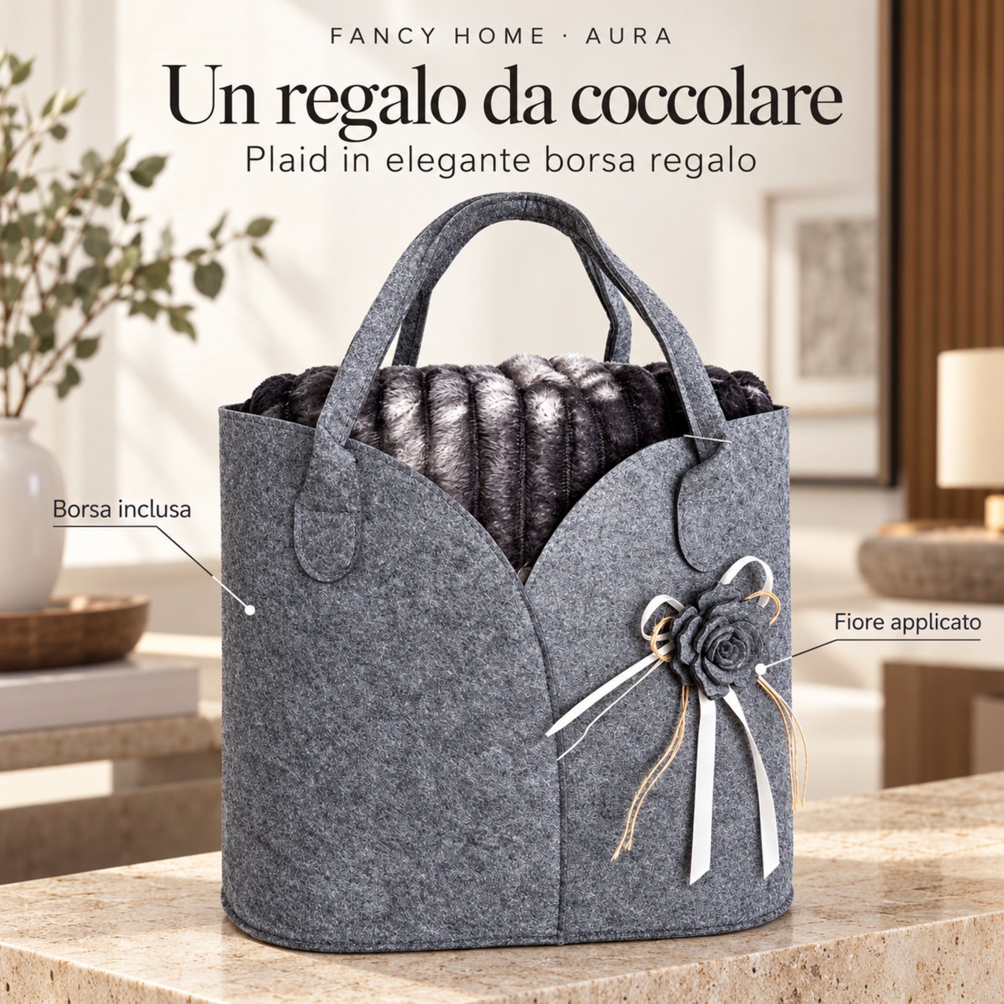 Plaid Aura antracite nella borsa regalo scura con manici, fiore decorativo e nastri chiari.