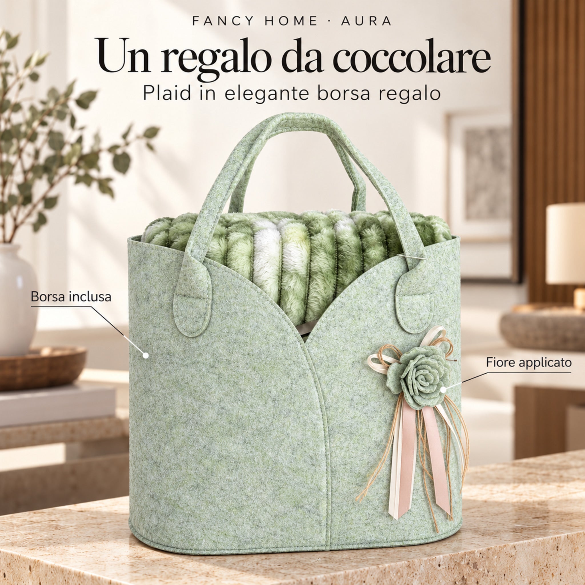 Borsa regalo verde chiaro contenente il plaid Aura verde, decorata con un fiore applicato e nastri chiari.