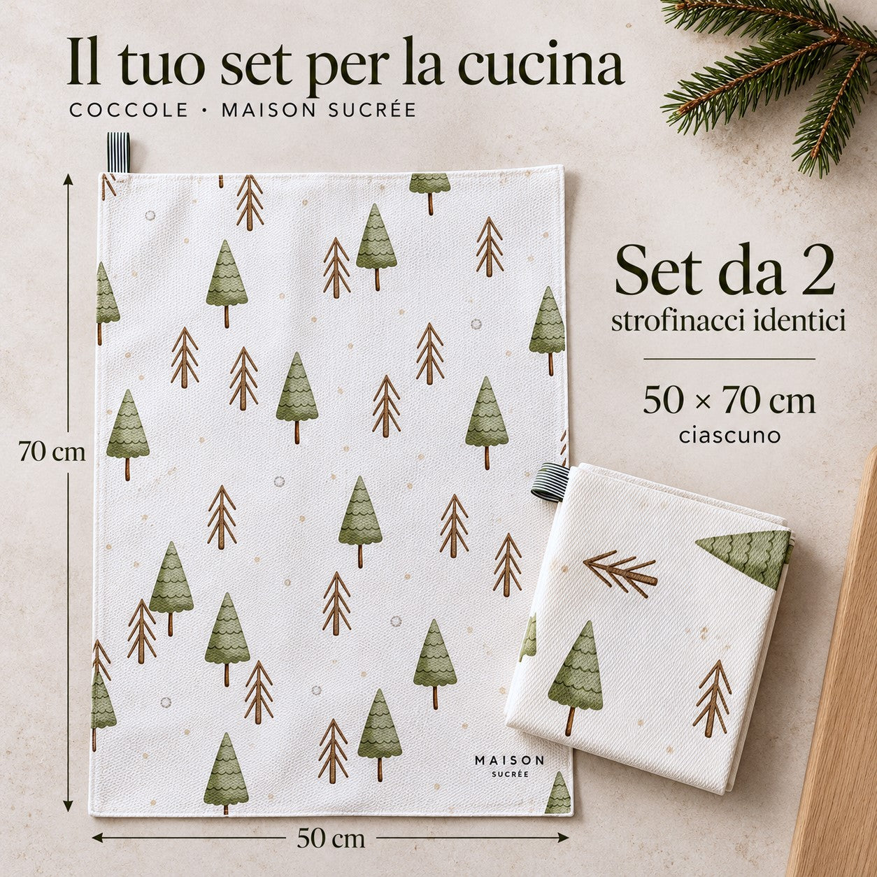 Set di due strofinacci Coccole identici con alberelli, uno disteso e uno piegato, con misure di 50x70 cm ciascuno.