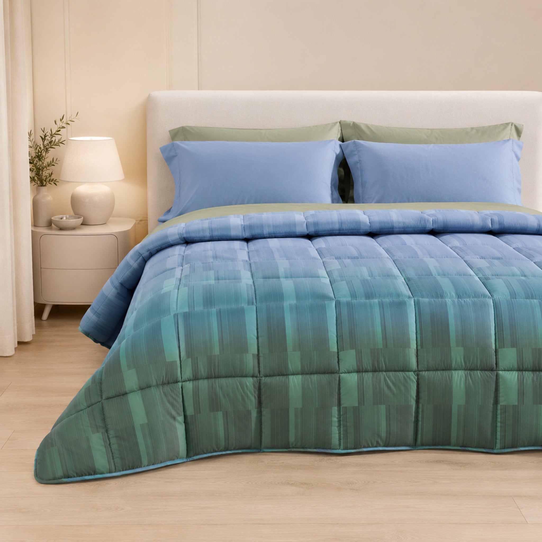 Trapunta invernale Caleffi Cloris Laguna 220x265 cm su letto da una piazza e mezza